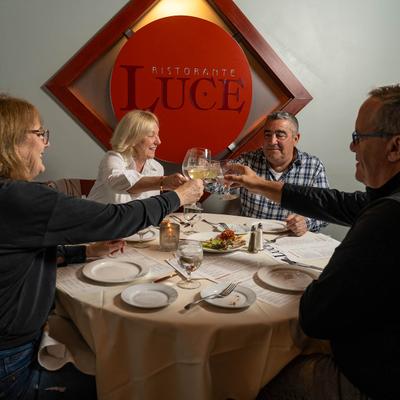 Customers toasting with drinks.
