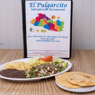 Shredded beef with mixed vegetables, salad, rice, beans and tortillas