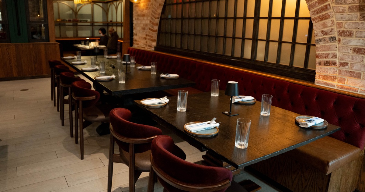 Interior, set tables and chairs ready for guests