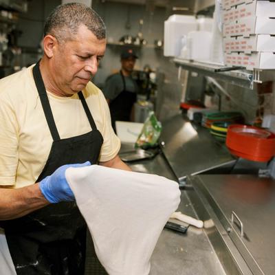 The cook preparing dough.