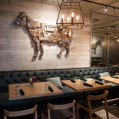 Cow shaped wall decoration and banquette seating