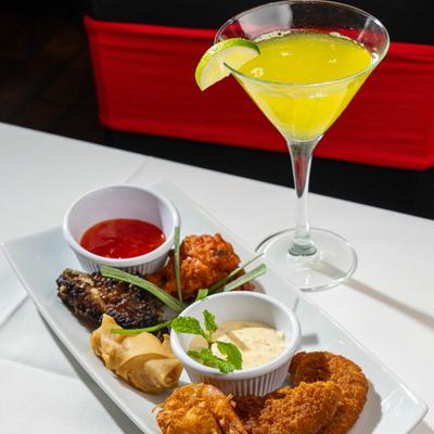 Appetizer platter with dipping sauces.