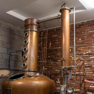 A room with copper distiller and other equipment.