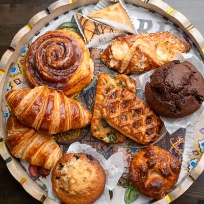 A decorative tray filled with various pastries..