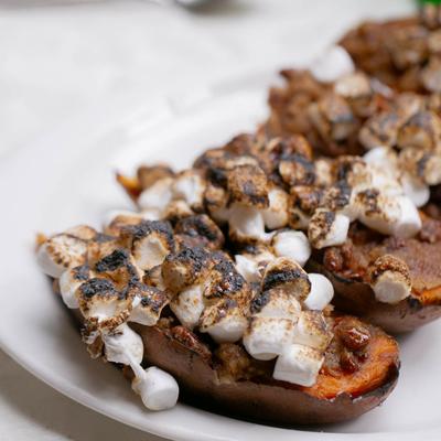 Twice baked sweet potatoes topped with charred marshmallows.