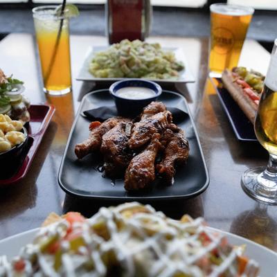 Assorted food plates and drinks.