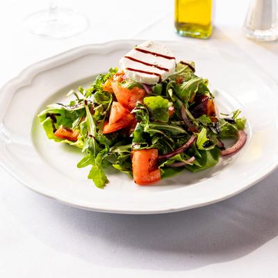 Arugula salad, with cheese, tomato, red onion, and balsamic.