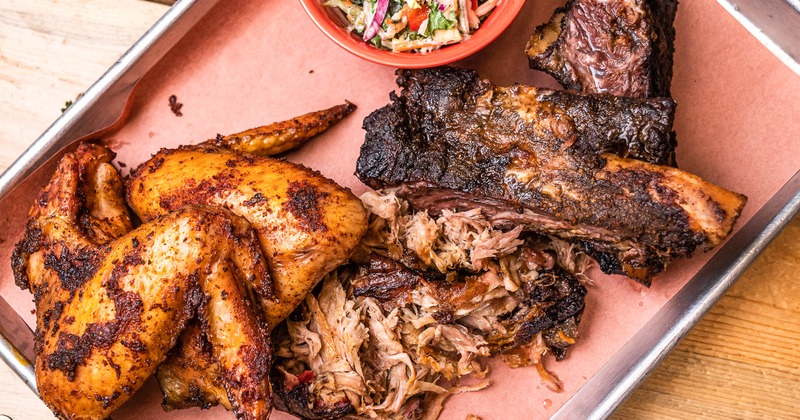 Three meat on a plate with salad on the side, top view