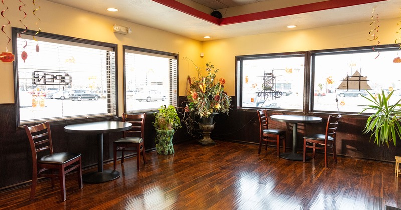 Interior, tables and chairs by the window