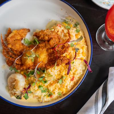 Seasonal risotto topped with crispy shrimp.