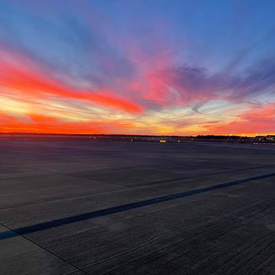 A stunning sunset sky over the airport.