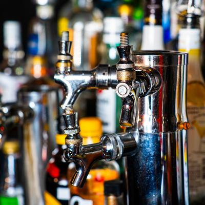 Bar detail, a beer tap and spirits.