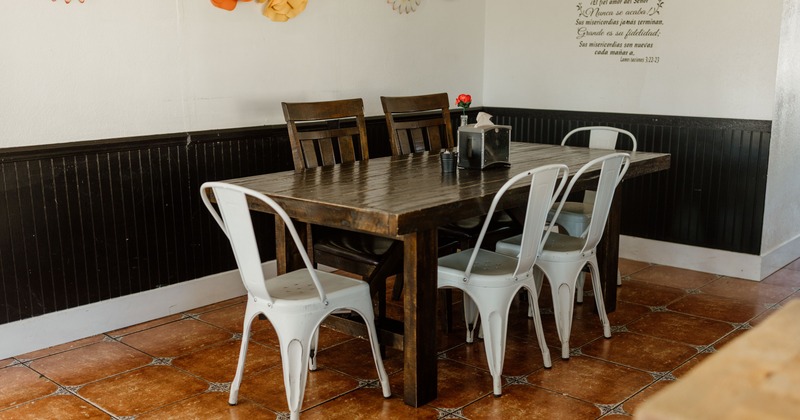 Interior with wooden tables and chairs