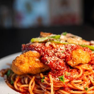Chicken Parmigiana with spaghetti.