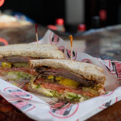 The K9er Sandwich with hot roast beef, cheese, lettuce, and tomatoes.