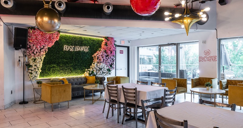 Elegant Interior, table with a Rose Lounge neon sign behined it