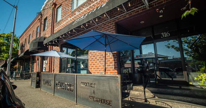 Exterior, side walk patio, parasols, tables, chairs