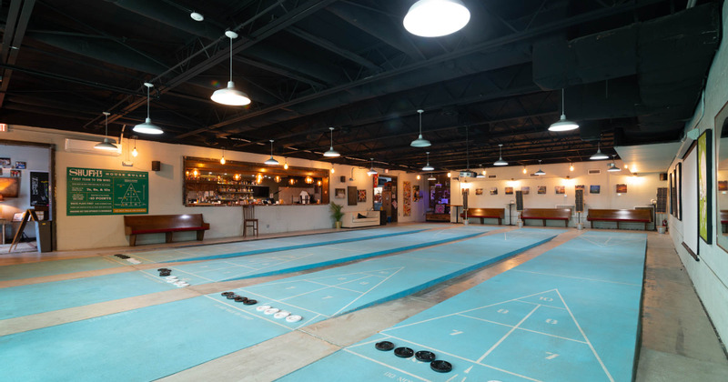 Four indoor regulation size shuffleboard courts