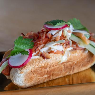 Hot dog, served, side view, closeup.