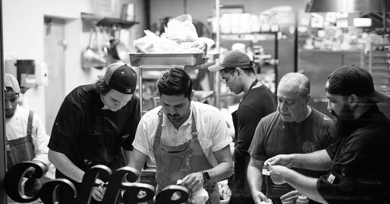 Staff members preparing food