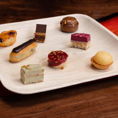 Various mini deserts arranged on a tray.