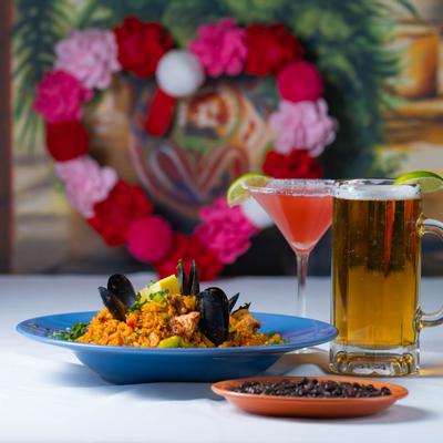 Valentine's Day paella dish served with beer and Margarita