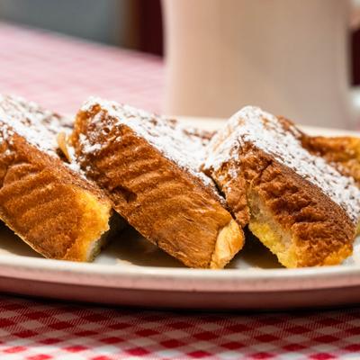 Cinnamon french toast dusted with powdered sugar.