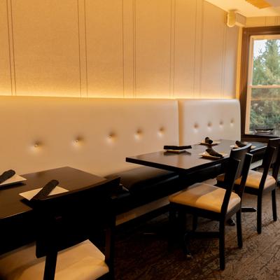 Restaurant interior, cozy dining room with set dining tables for small private parties.