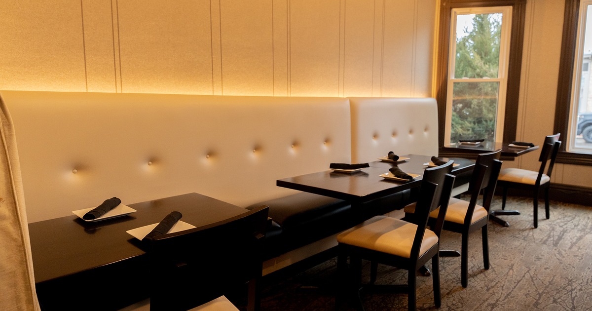 Restaurant interior, cozy dining room with set dining tables