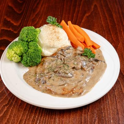 Chicken breast with mushrooms, sherry cream sauce, with mashed potatoes and veggies.