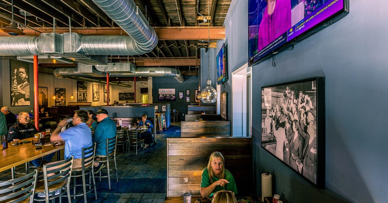 Interior, booths and tables with guests dining