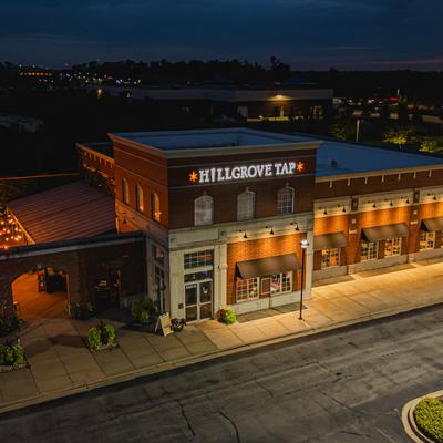 Exterior, storefront with entrance and a sign, areial view.