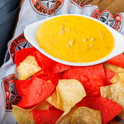 Tortilla chips and cheese dip.