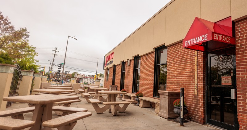 Exterior, patio, tables and benches,  entrance