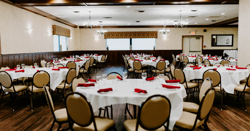 Interior, dining tables with tableware and glasses