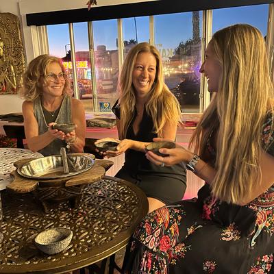 Guests participating in kava preparation.