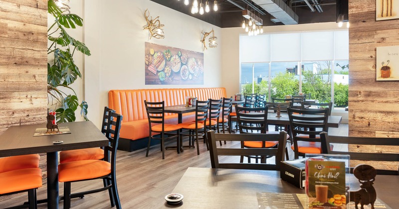 Interior, long seating bench, tables and chairs