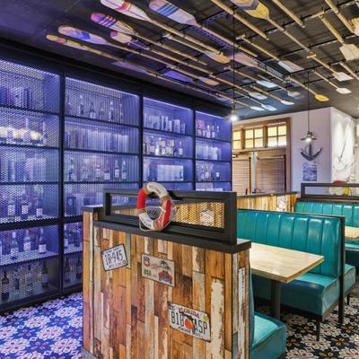 Teal booths in nautical themed dining area.