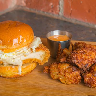 Fried chicken and egg sandwich, with cheesy hash brown fritters.