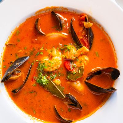 Seafood stew with shrimp, mussels, tuna, and tomato broth.