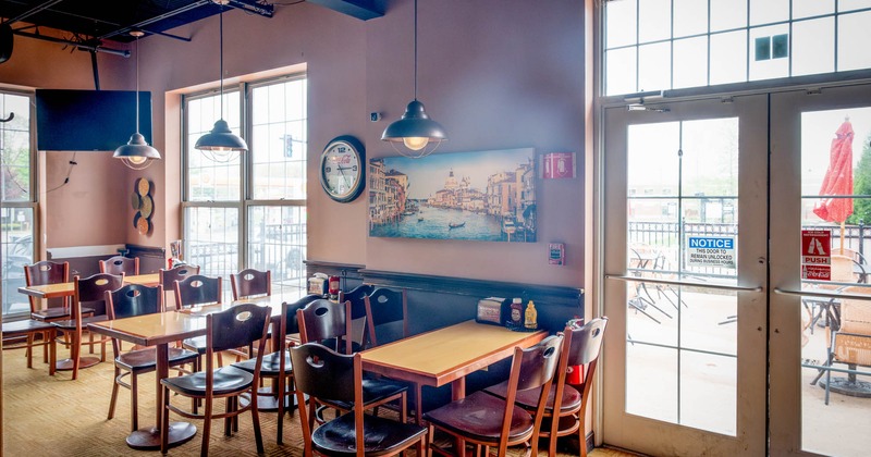 Tables for multiple people by the windows