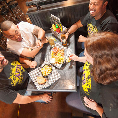 Four guests at the table, eating and having fun