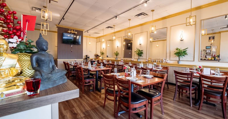 Spacious and cozy interior dining area with set tables ready for guests