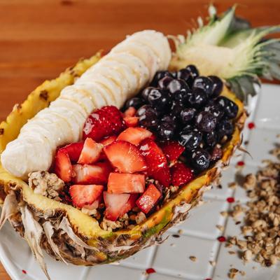 Aloha salad, served in a pineapple bowl.