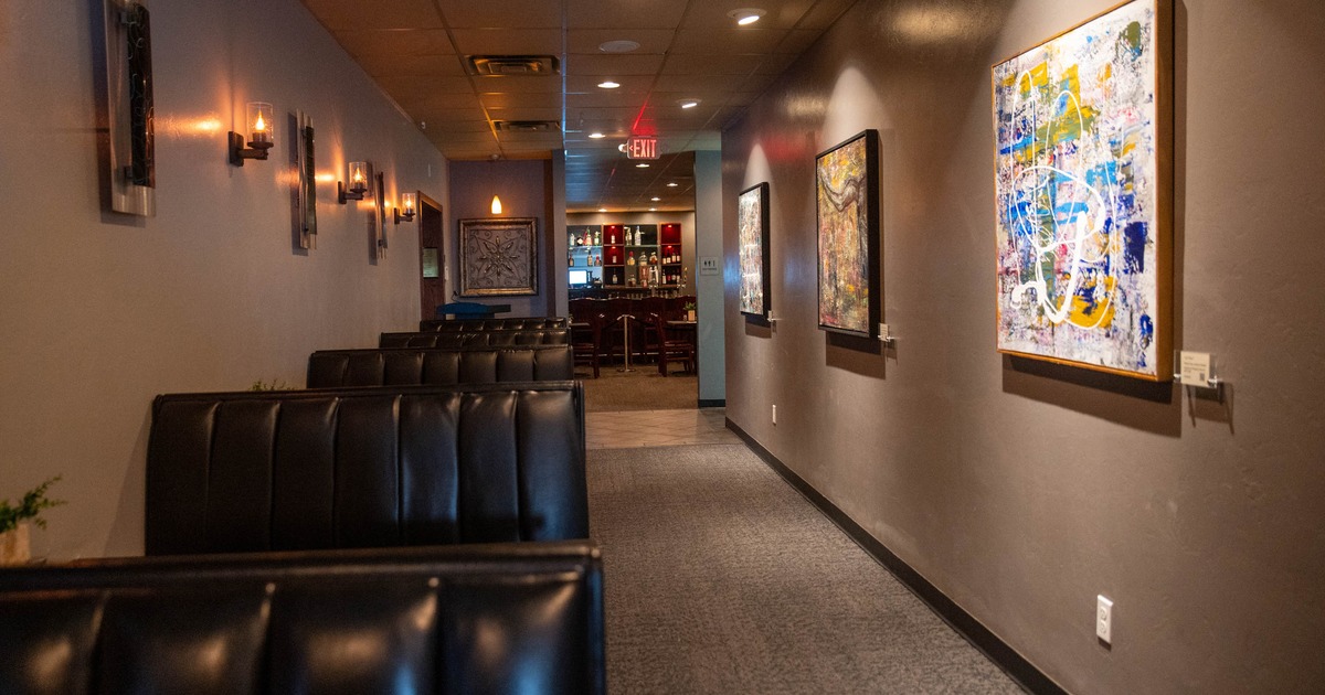 Interior, seating area with booths along the wall