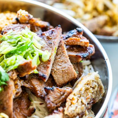 Extreme close up of a bowl with Brisket fried rice