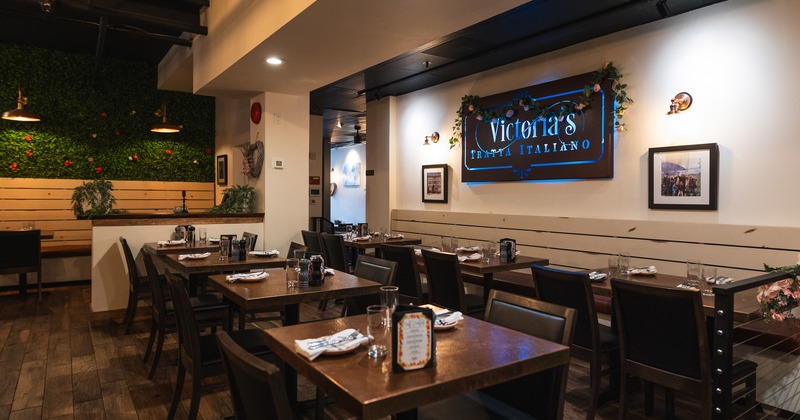 Modern and cozy restaurant interior dining area with set tables ready for guests
