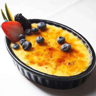 Creme brulee topped with berries.