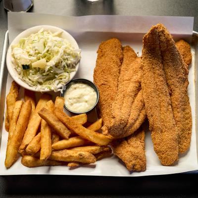 Fried catfish served with fries, coleslaw and a dipping sauce.