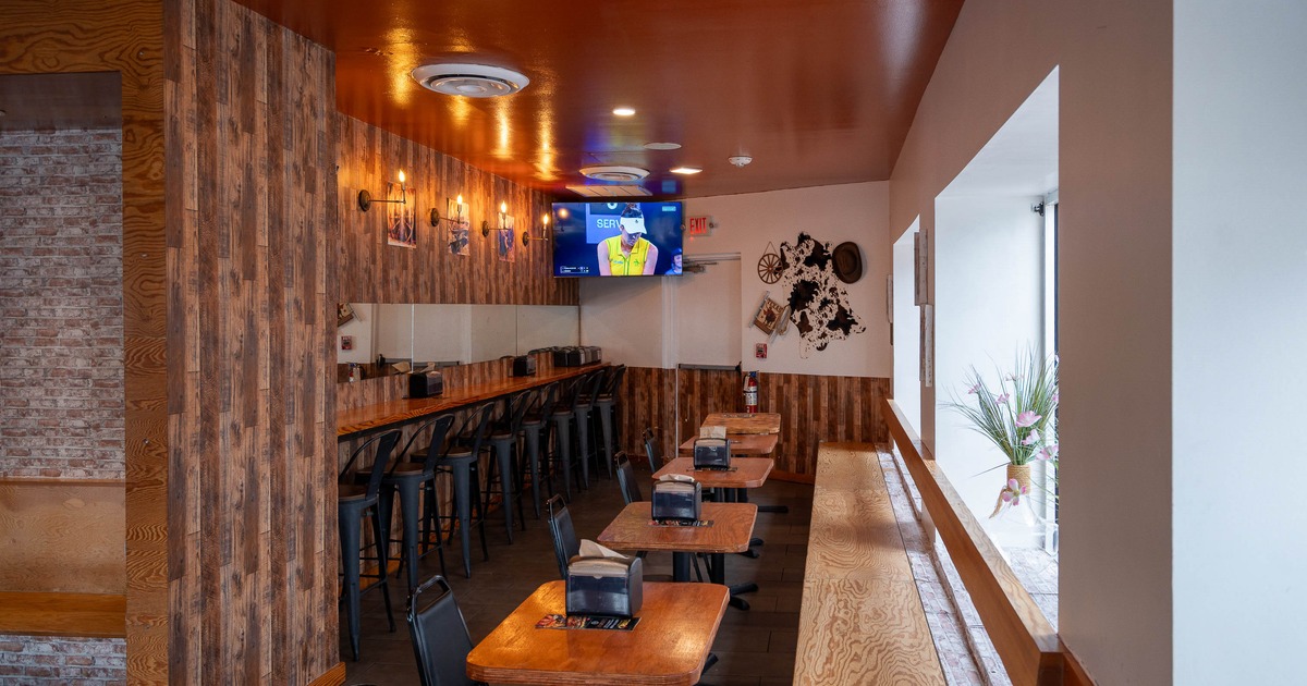 Restaurant interior with wooden walls and tables